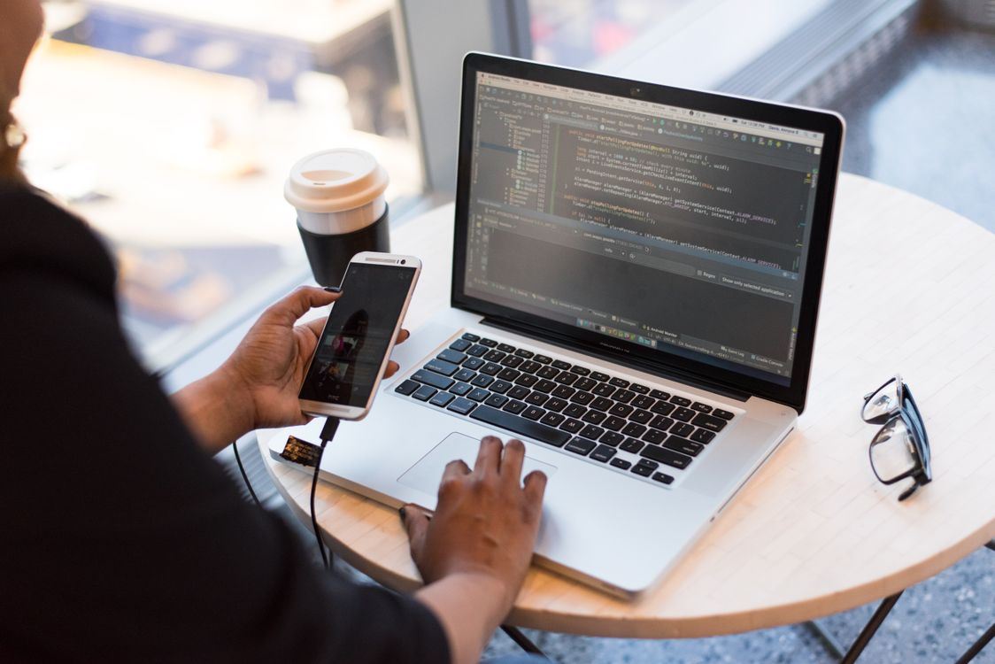 Developer troubleshooting WordPress plugin conflict on desktop computer