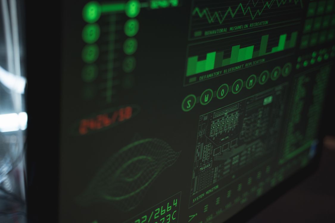 Close-up view of a computer screen displaying cybersecurity data and firewall protection interfaces