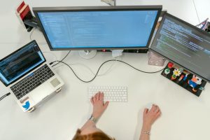 Developer enabling WordPress debugging mode on a laptop